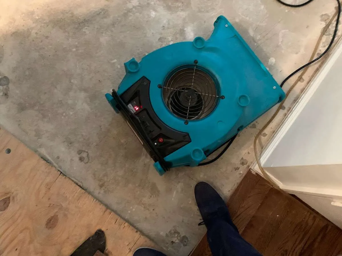 Air mover drying subfloor during Commercial Water Damage Restoration in Ewa Gentry